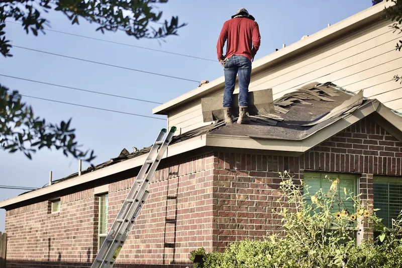 Professional roofer working on a residential roof in Buffalo Gap